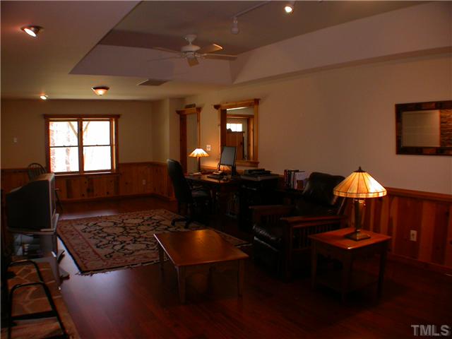 501 Pendleton Lake Road Raleigh, NC 27614 - Photo 16 of 23 a living room with furniture a rug and a piano