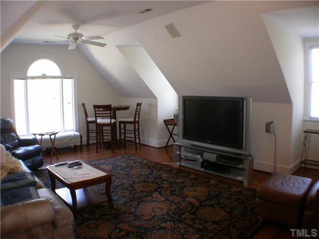 501 Pendleton Lake Road Raleigh, NC 27614 - Photo 8 of 23 a living room with furniture a window and a flat screen tv