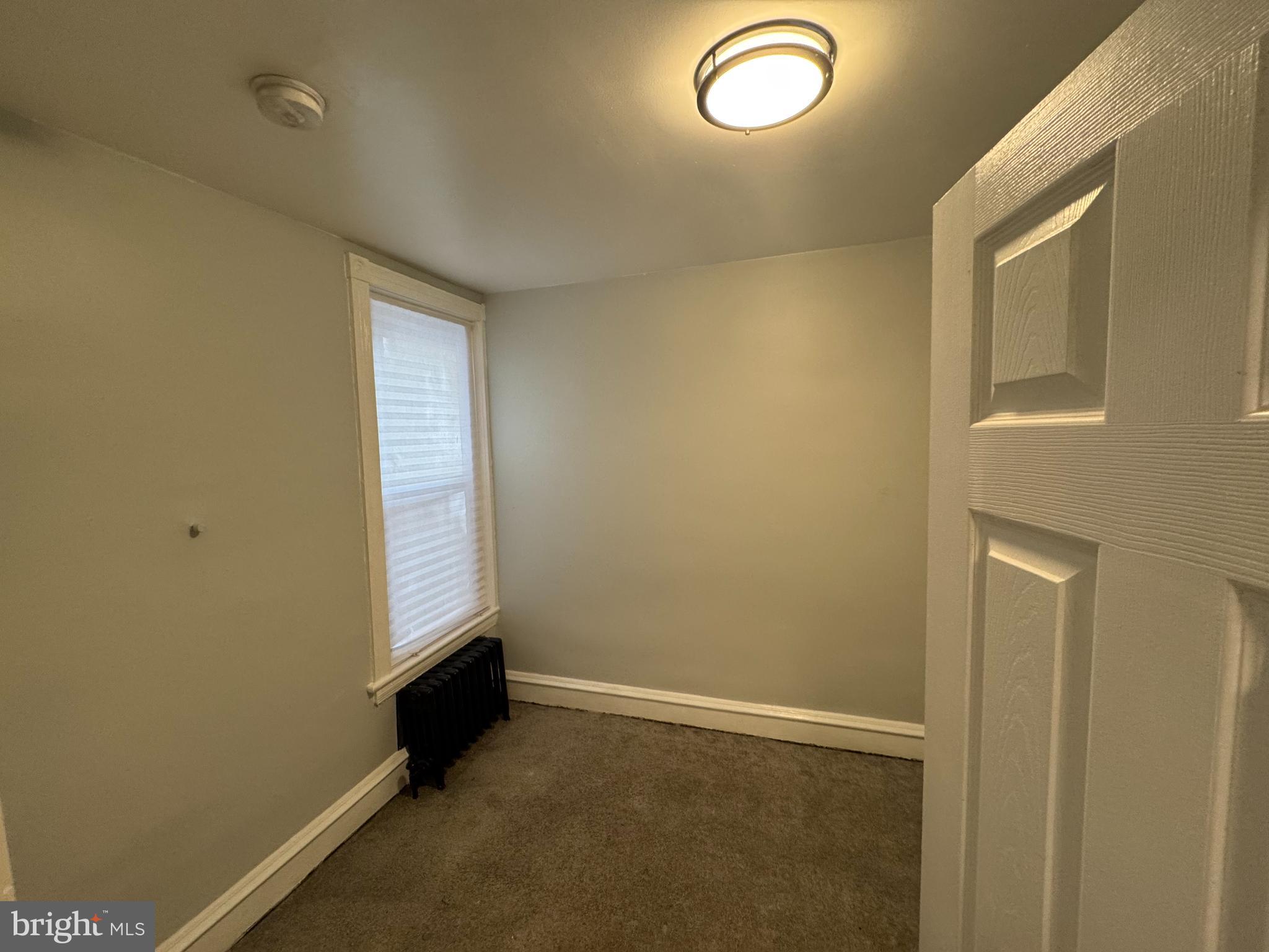 5502 Crowson Street Philadelphia, PA 19144 - Photo 12 of 16 an empty room with windows