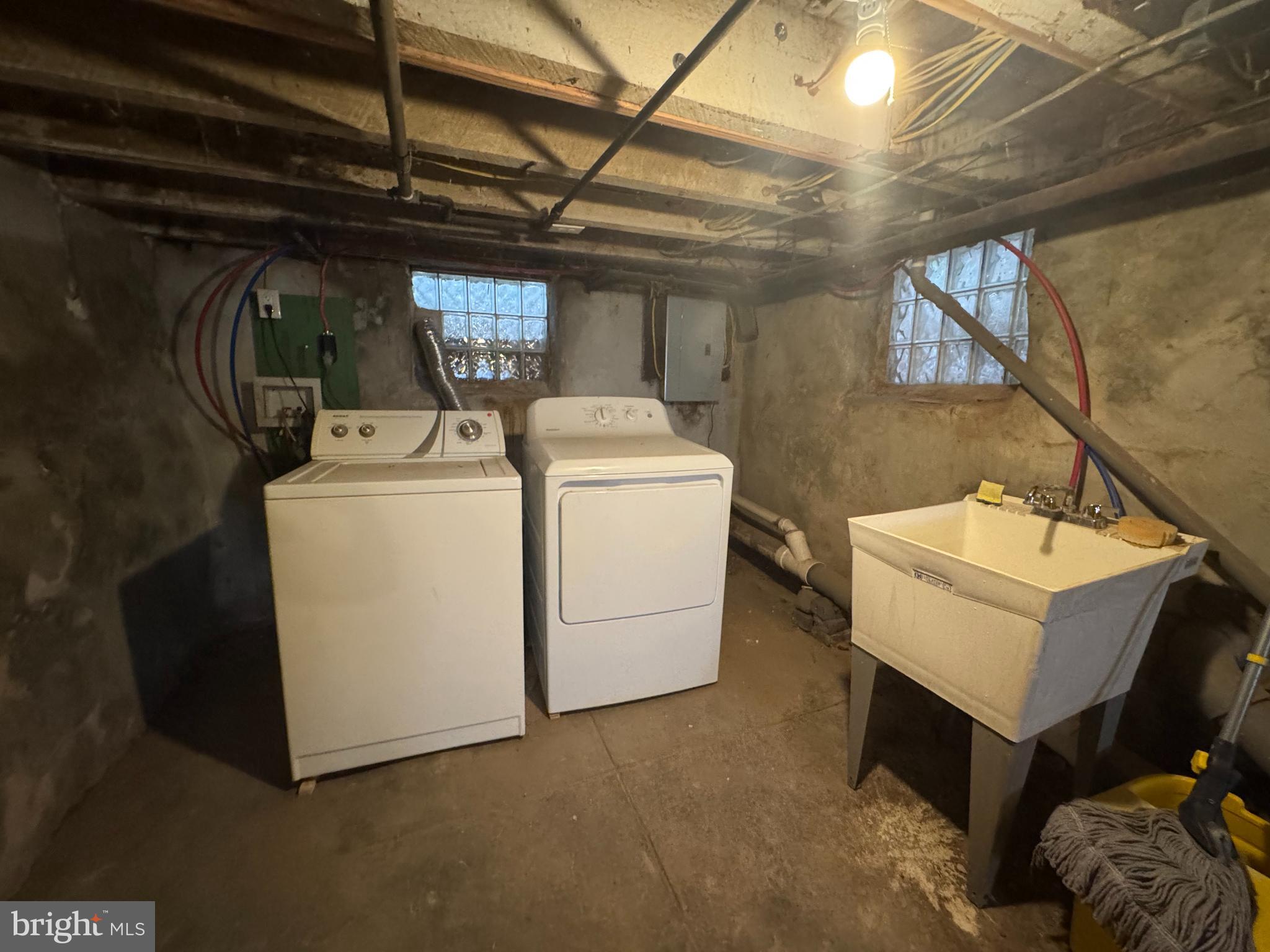 5502 Crowson Street Philadelphia, PA 19144 - Photo 16 of 16 a utility room with dryer and washer