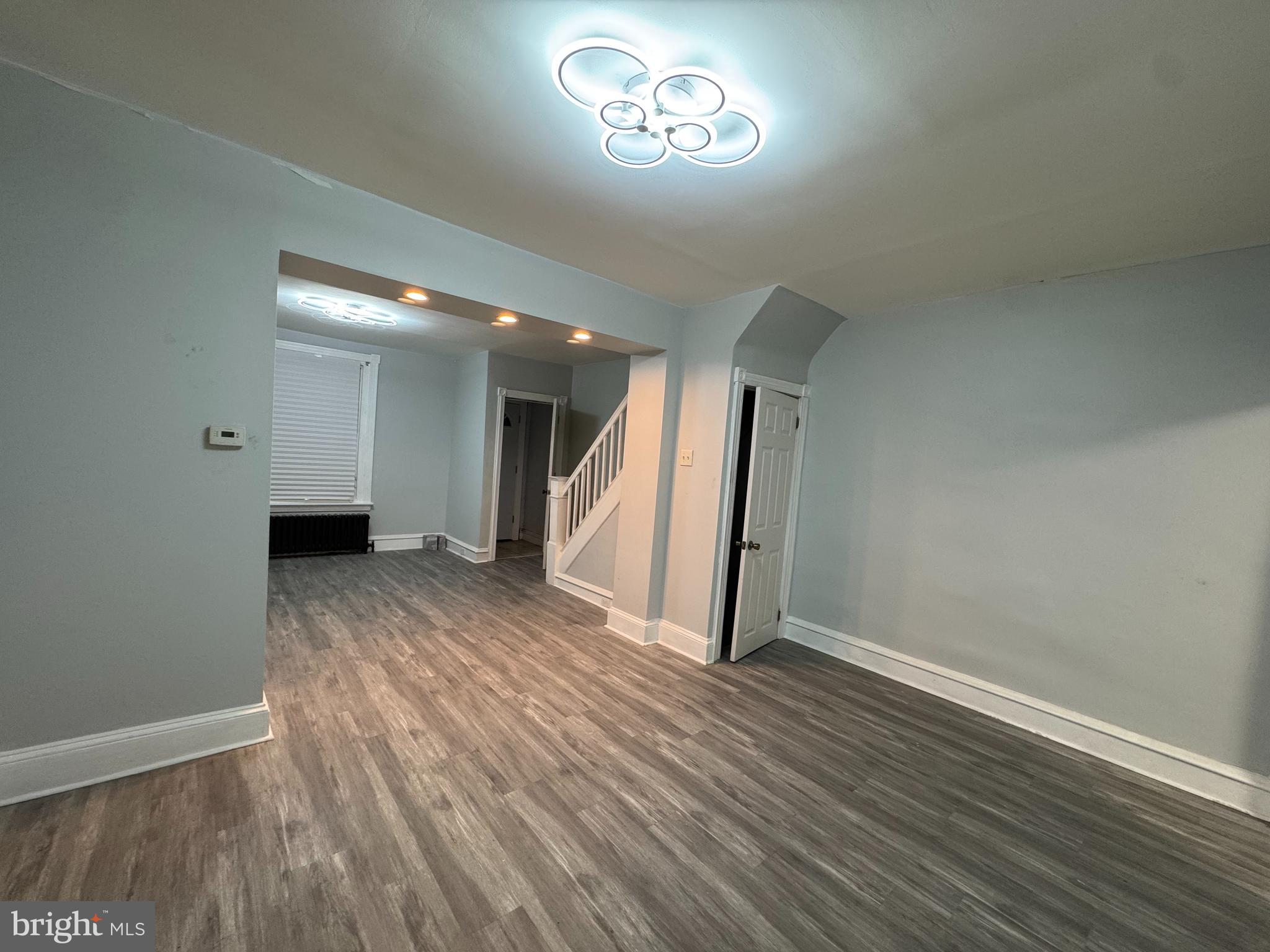 5502 Crowson Street Philadelphia, PA 19144 - Photo 3 of 16 wooden floor in an empty room with a window