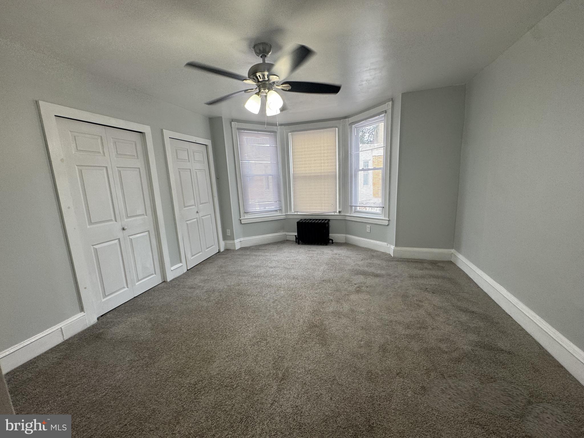 5502 Crowson Street Philadelphia, PA 19144 - Photo 7 of 16 a view of an empty room with a window