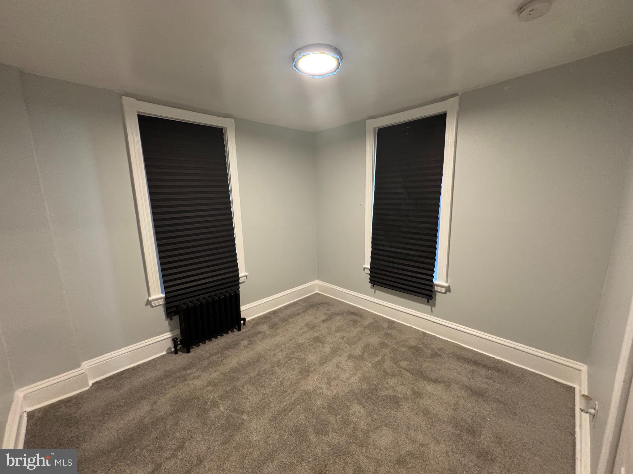 5502 Crowson Street Philadelphia, PA 19144 - Photo 9 of 16 an empty room with a hallway and stairs