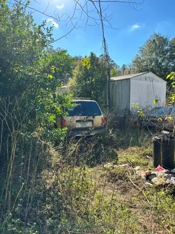 a backyard of a house with lots of green space