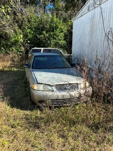 a view of a swimming pool with a yard