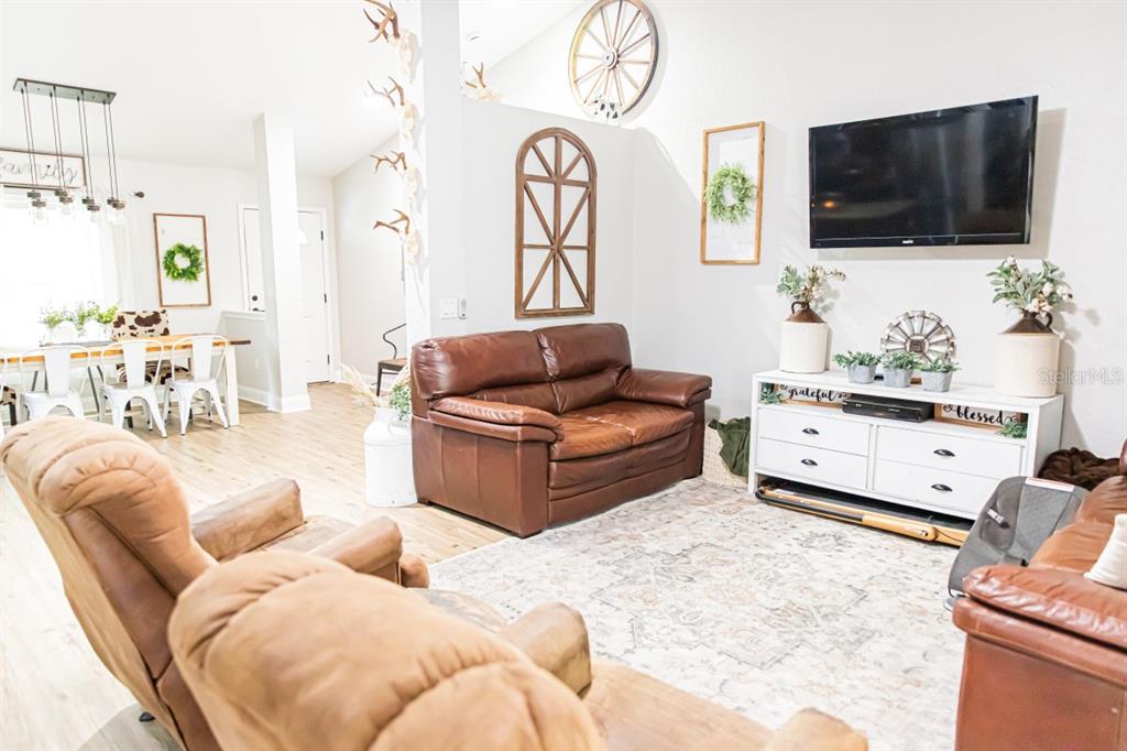 1533 County Road 13 Bunnell, FL 32110 - Photo 14 of 49 a living room with furniture and a flat screen tv