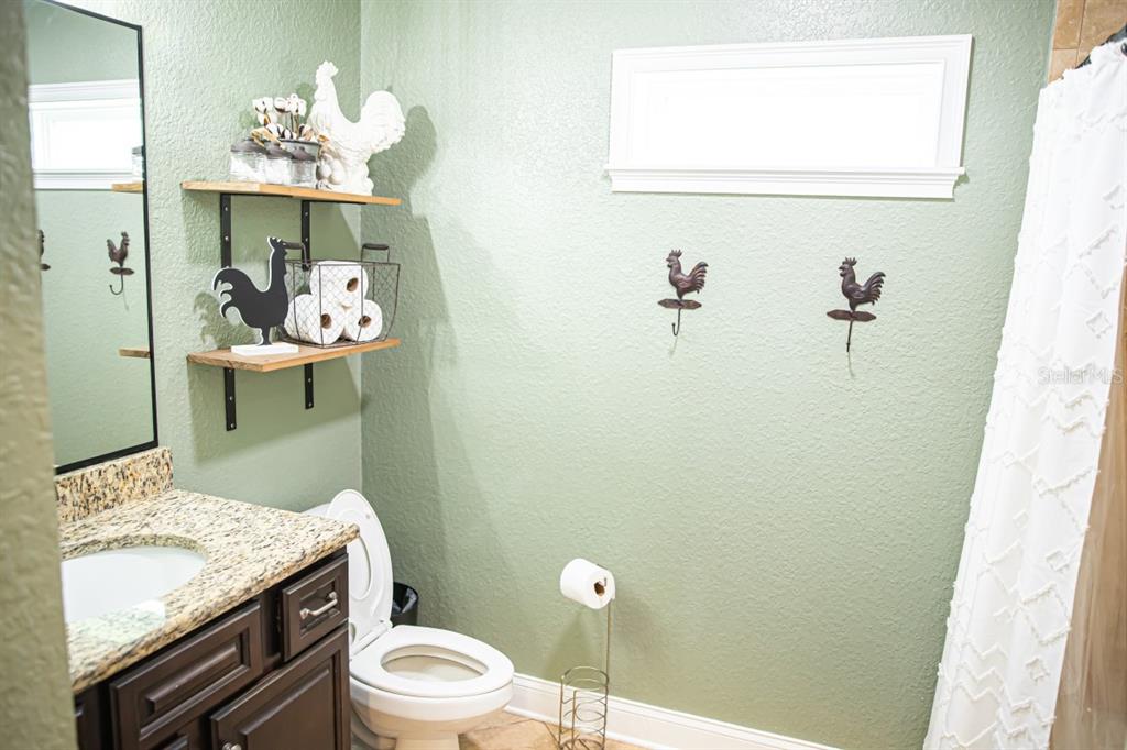 1533 County Road 13 Bunnell, FL 32110 - Photo 22 of 49 a bathroom with a granite countertop sink mirror and toilet