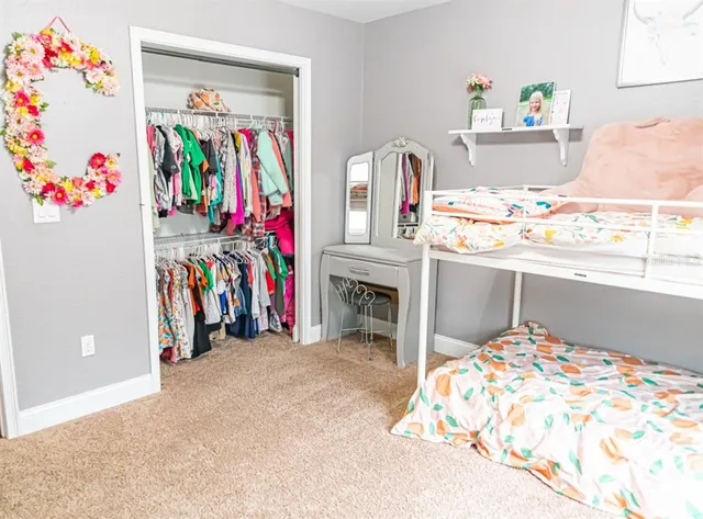 a bed room with a bed and a couch