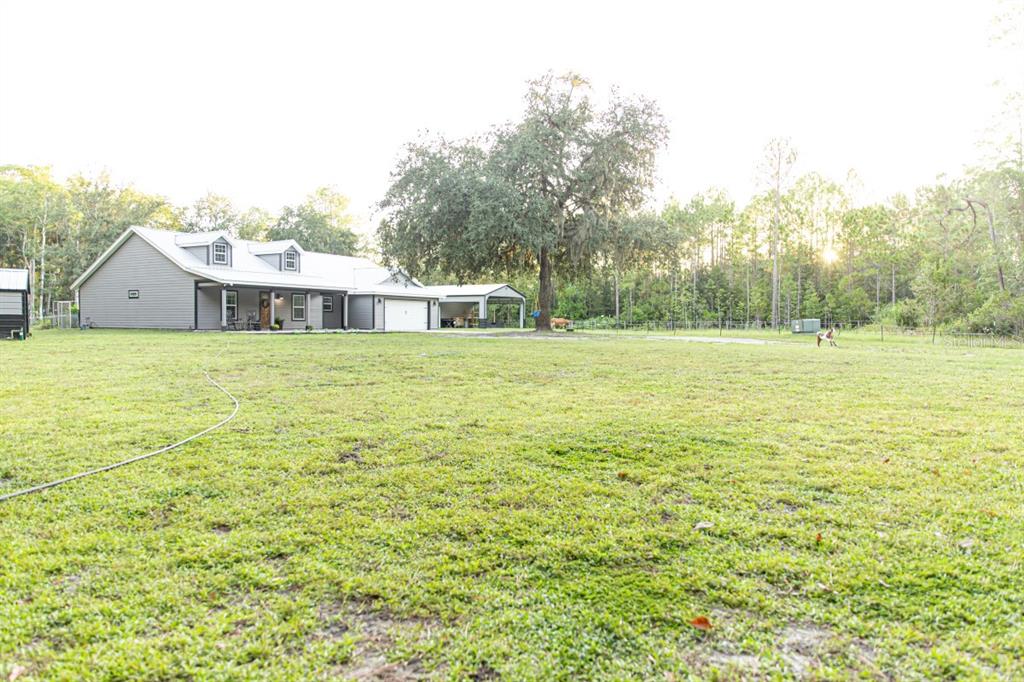 1533 County Road 13 Bunnell, FL 32110 - Photo 41 of 49 a view of a large garden with an outdoor space