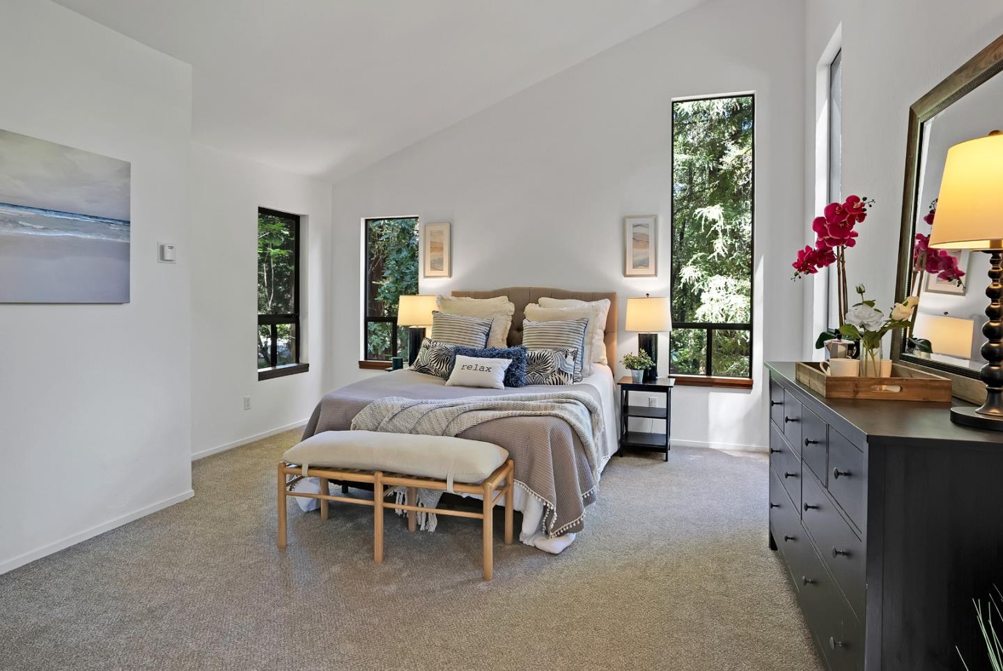 22540 Echo Drive Los Gatos, CA 95033 - Photo 14 of 41 a bedroom with a bed and a chandelier