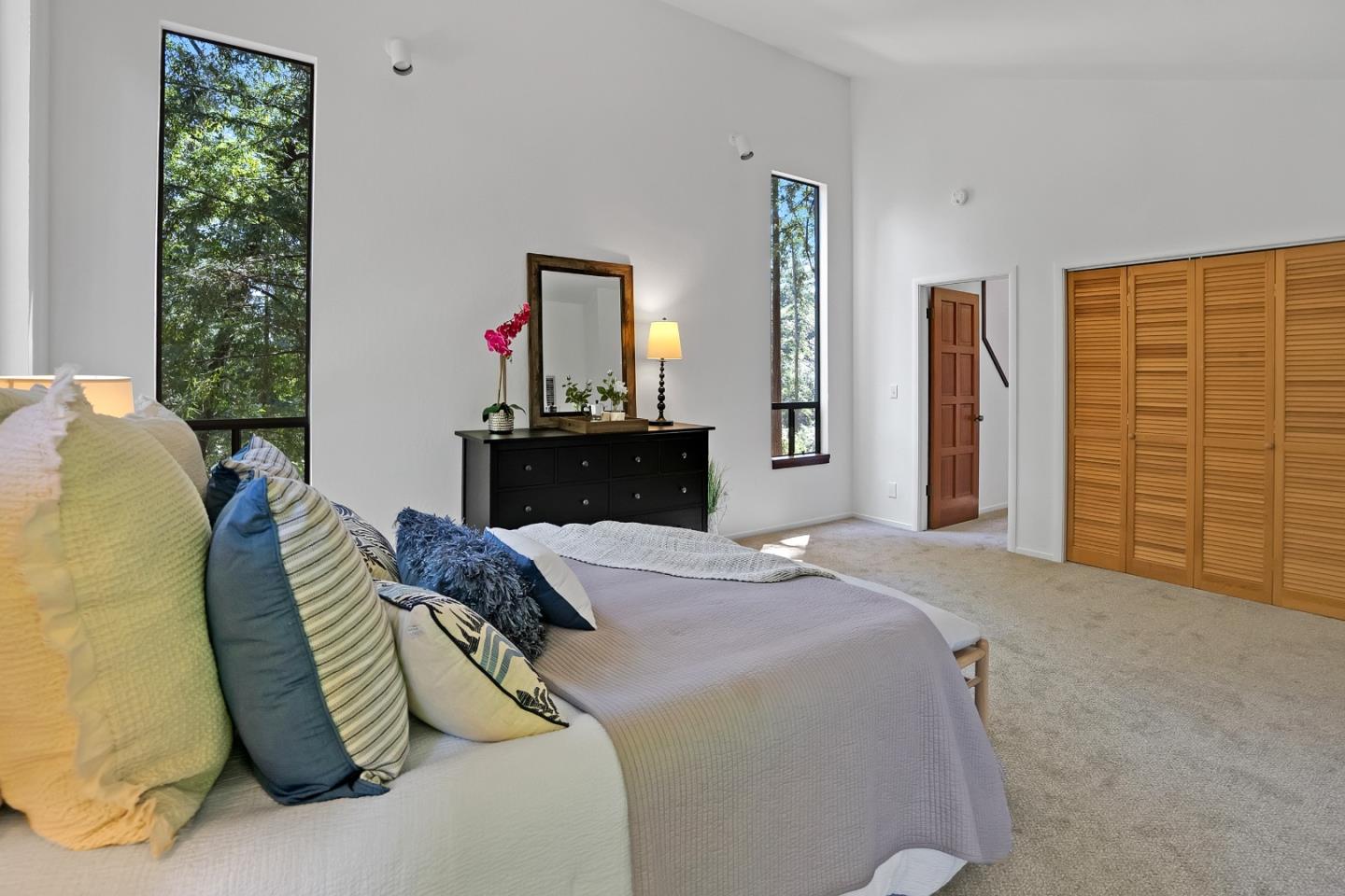 22540 Echo Drive Los Gatos, CA 95033 - Photo 15 of 41 a bedroom with a bed and dresser with mirror