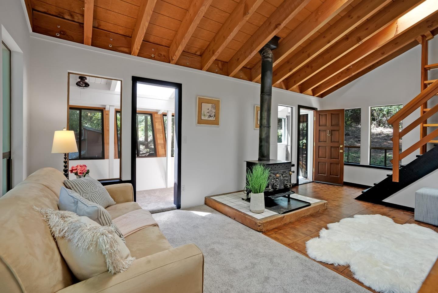 22540 Echo Drive Los Gatos, CA 95033 - Photo 20 of 41 a living room with furniture wooden floor and a chandelier