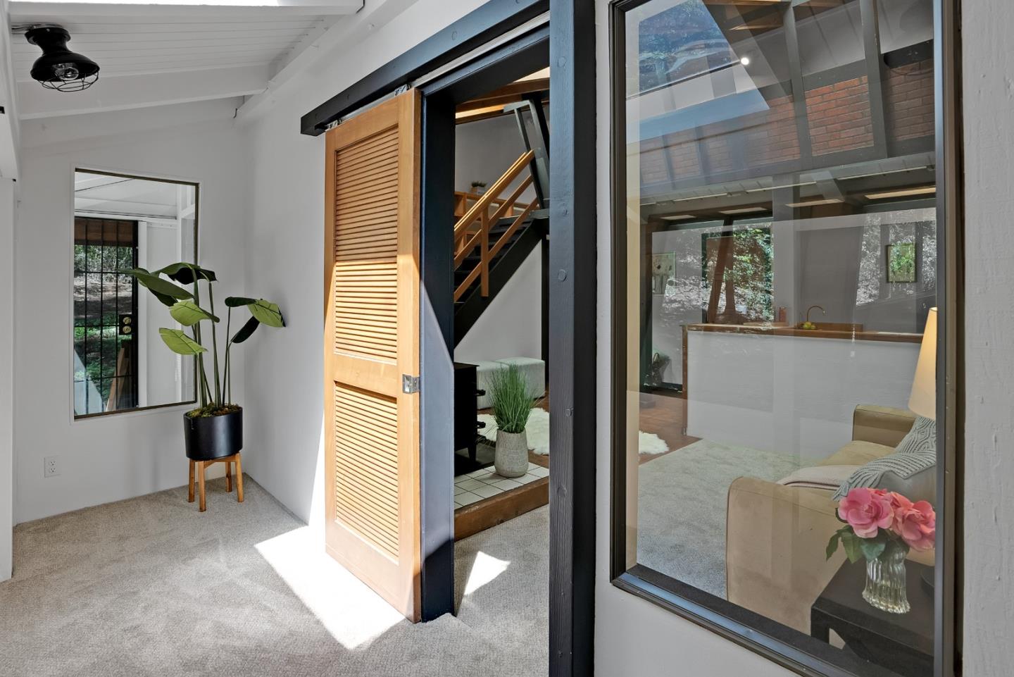 22540 Echo Drive Los Gatos, CA 95033 - Photo 28 of 41 a hallway with painting and a potted plant