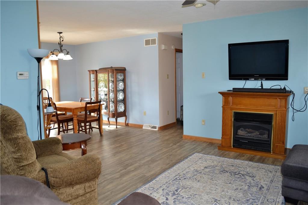 192 Elderton Heights Road Elderton, PA 15736 - Photo 4 of 20 Gas fireplace and LVP flooring in living room which opens to the dining room for great flow