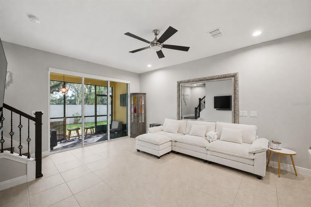 2013 Sunset Wind Loop Oldsmar, FL 34677 - Photo 5 of 43 a living room with furniture and a large window