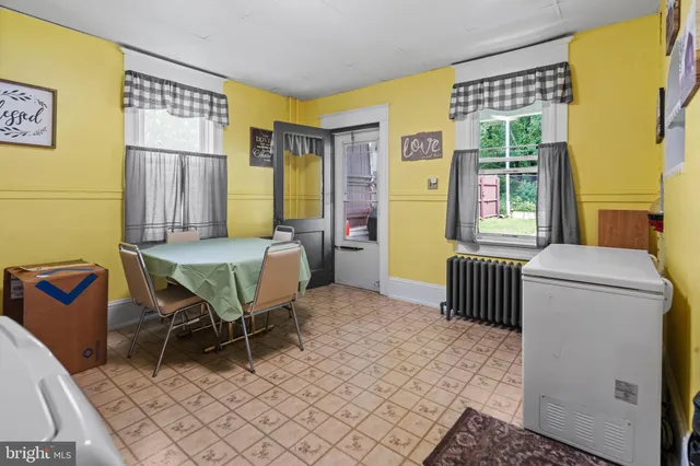 a bedroom with furniture and a window