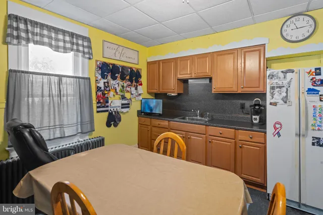 a bedroom with a bed and a table with chair