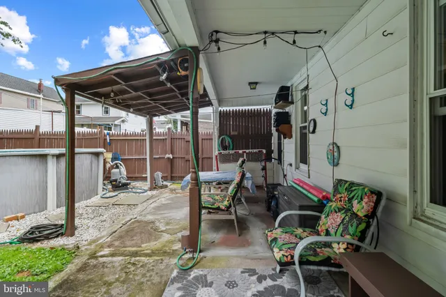 a view of a chairs and table in a patio