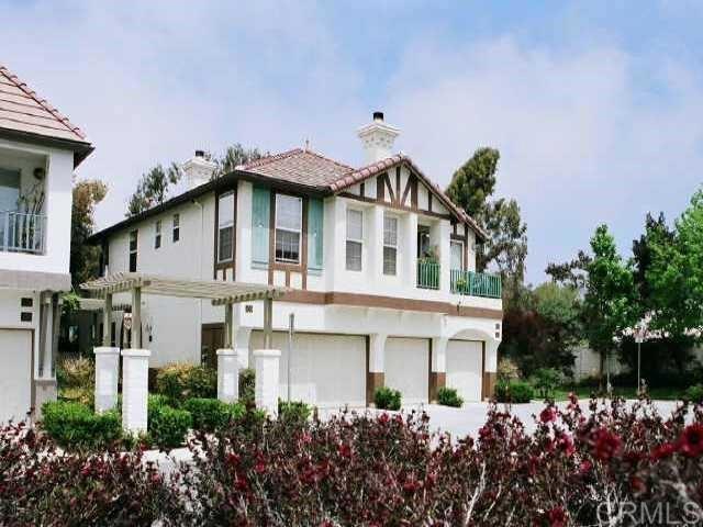 442 Carmel Creeper Place Encinitas, CA 92024 - Photo 7 of 12 a front view of a house with a garden