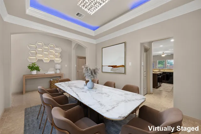 a dining room with furniture and window