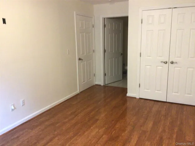 a view of a livingroom with wooden floor