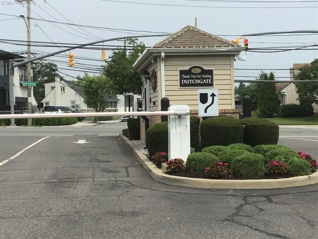 a view of a white house with a outdoor space