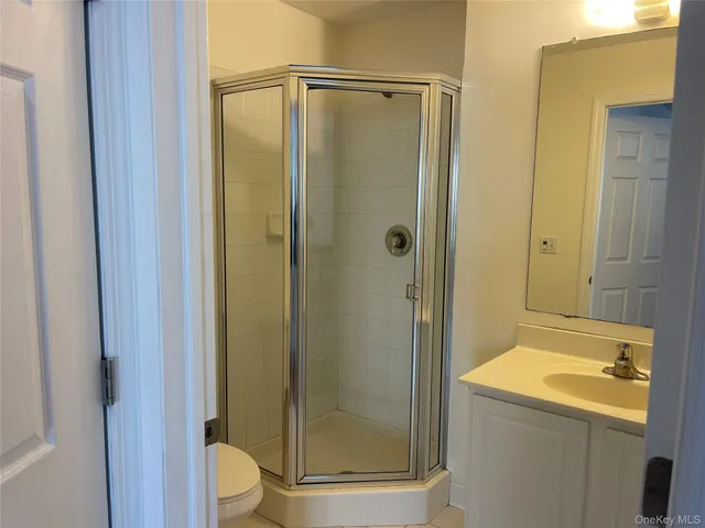 a bathroom with a shower and a sink