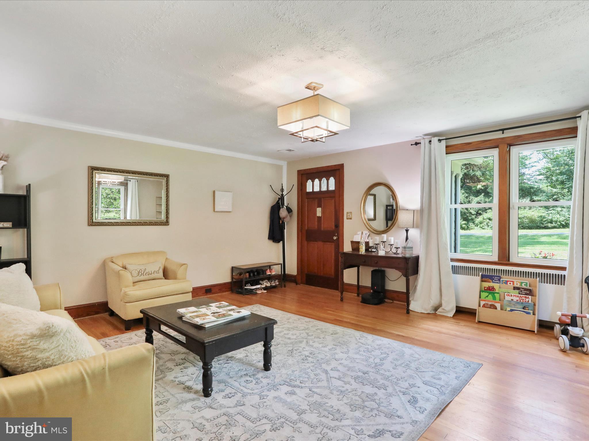 6927 Kellys Store Road Thurmont, MD 21788 - Photo 11 of 42 a living room with furniture and a dining table