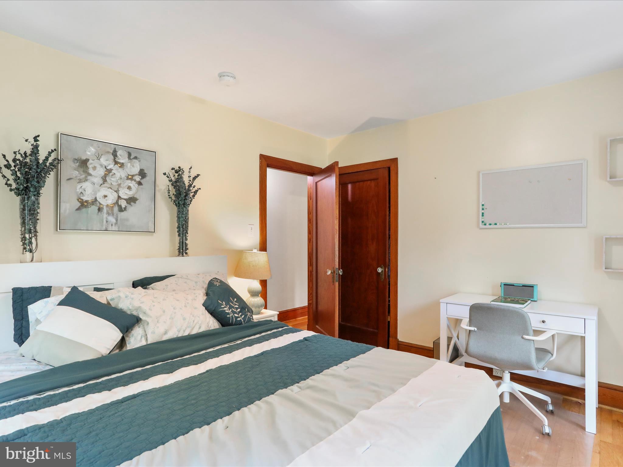 6927 Kellys Store Road Thurmont, MD 21788 - Photo 19 of 42 a bedroom with a bed and a lamp on dresser