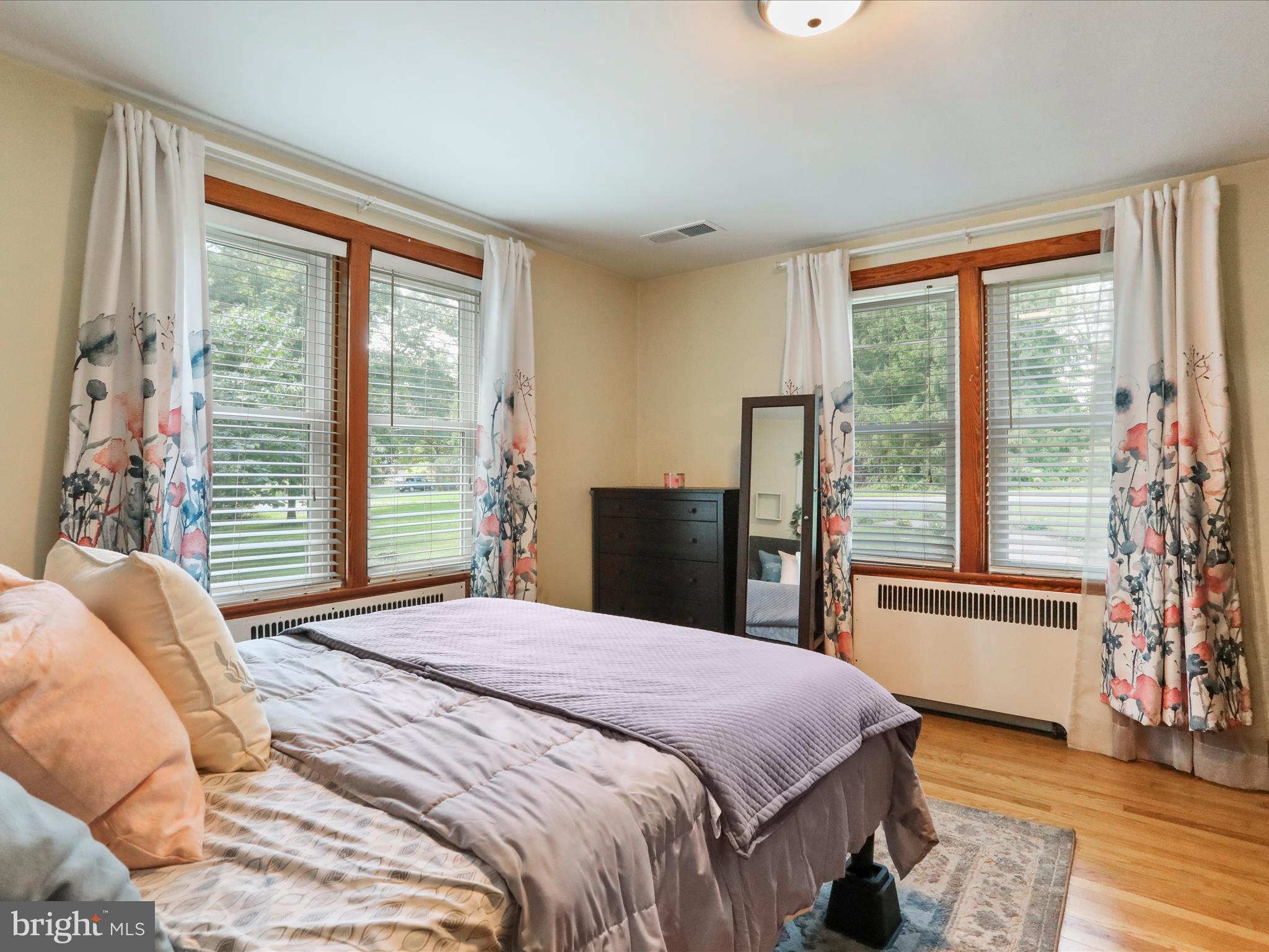 6927 Kellys Store Road Thurmont, MD 21788 - Photo 21 of 42 a bedroom with a large bed and a large window