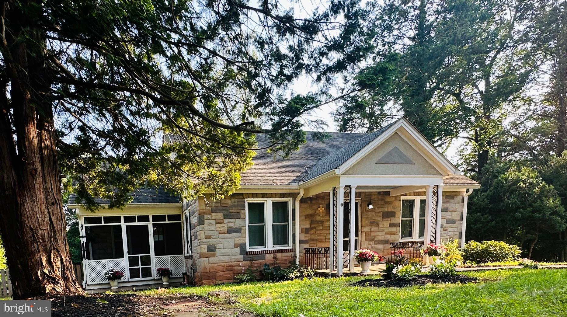 6927 Kellys Store Road Thurmont, MD 21788 - Photo 38 of 42 a front view of a house with garden