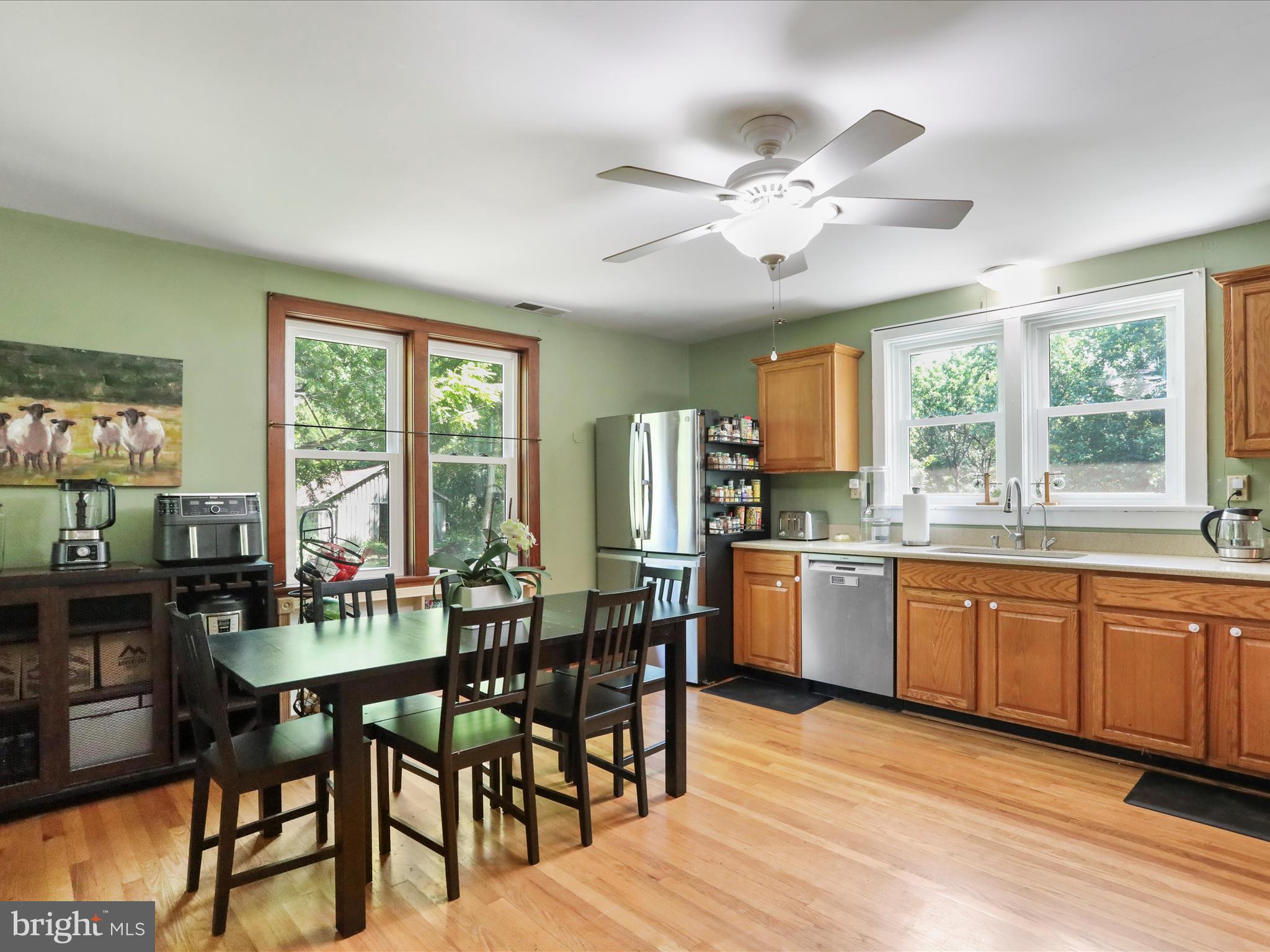 6927 Kellys Store Road Thurmont, MD 21788 - Photo 4 of 42 a kitchen with stainless steel appliances granite countertop a stove top oven a dining table and chairs