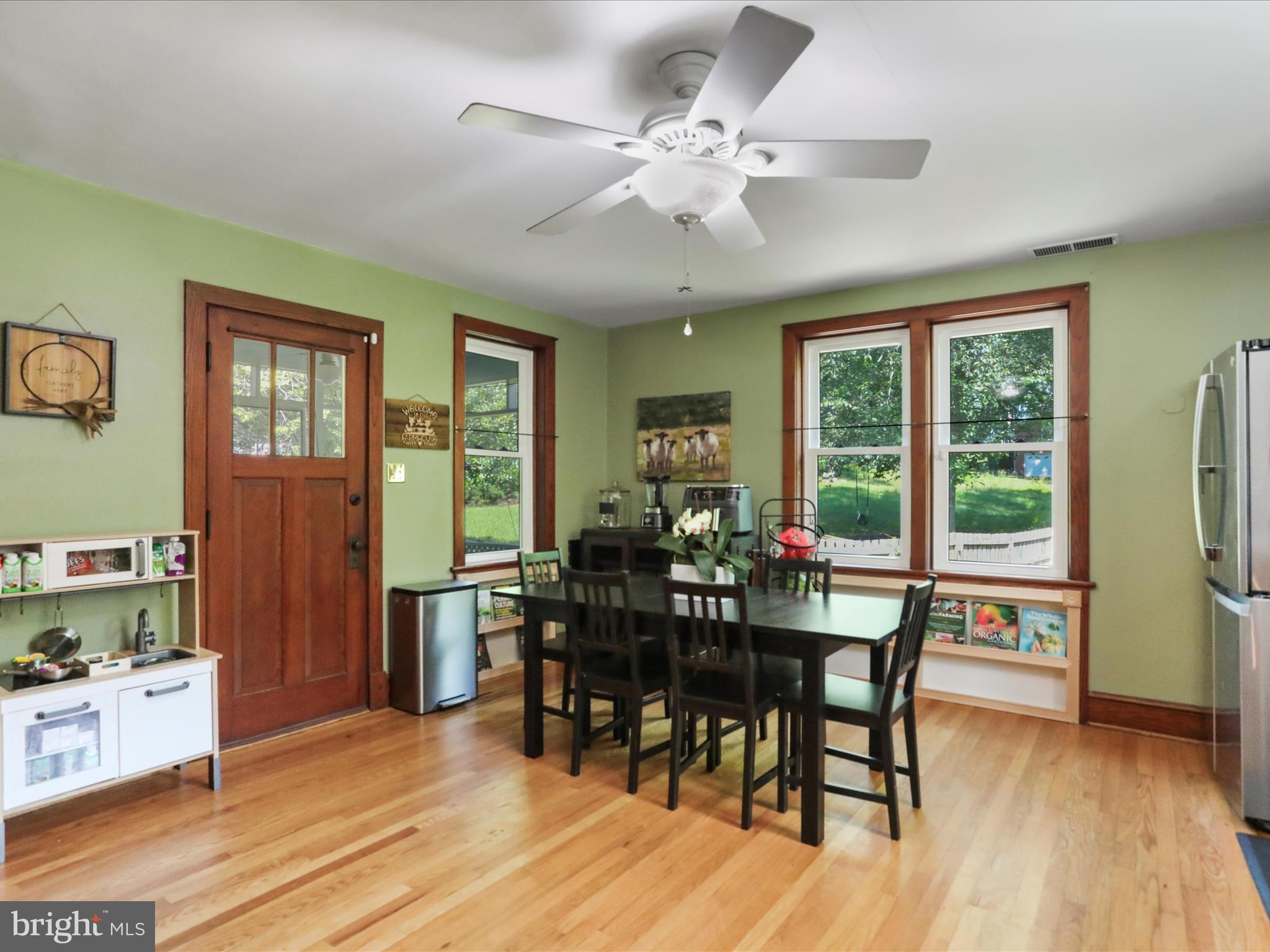 6927 Kellys Store Road Thurmont, MD 21788 - Photo 7 of 42 a view of a dining room with furniture window and wooden floor