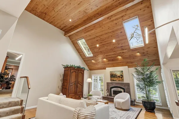 a dining room with furniture and wooden floor