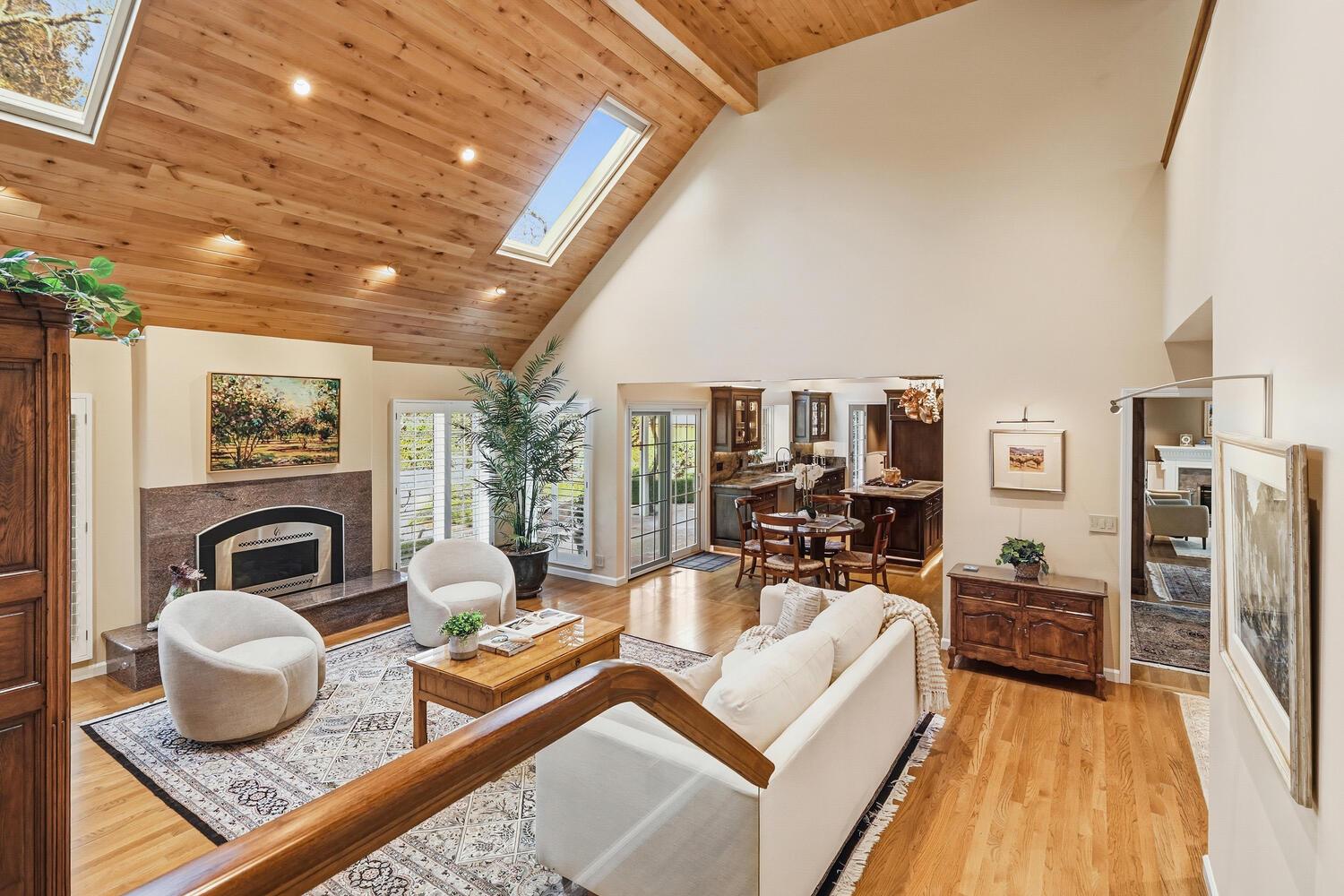 1749 Haggin Grove Way Carmichael, CA 95608 - Photo 19 of 99 a living room with furniture a fireplace and a flat screen tv
