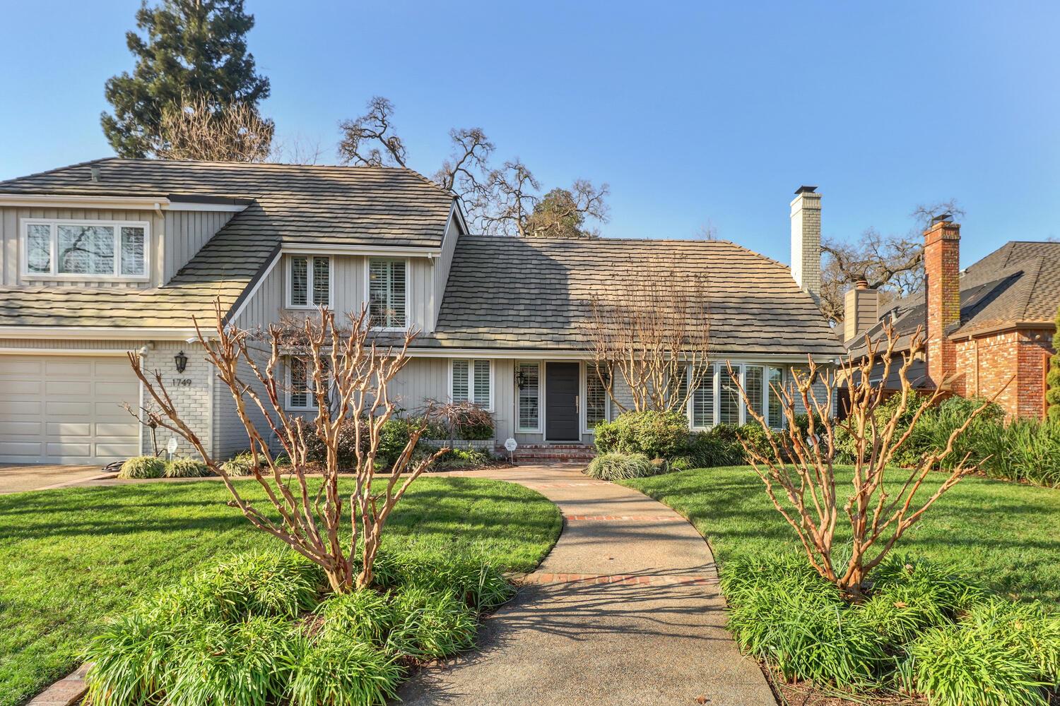 1749 Haggin Grove Way Carmichael, CA 95608 - Photo 2 of 99 a front view of a house with garden