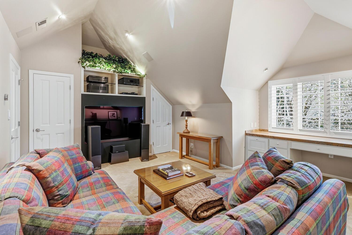 1749 Haggin Grove Way Carmichael, CA 95608 - Photo 46 of 99 a living room with furniture a flat screen tv and a fireplace