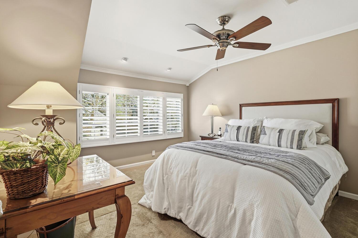 1749 Haggin Grove Way Carmichael, CA 95608 - Photo 51 of 99 a bedroom with a bed and a table