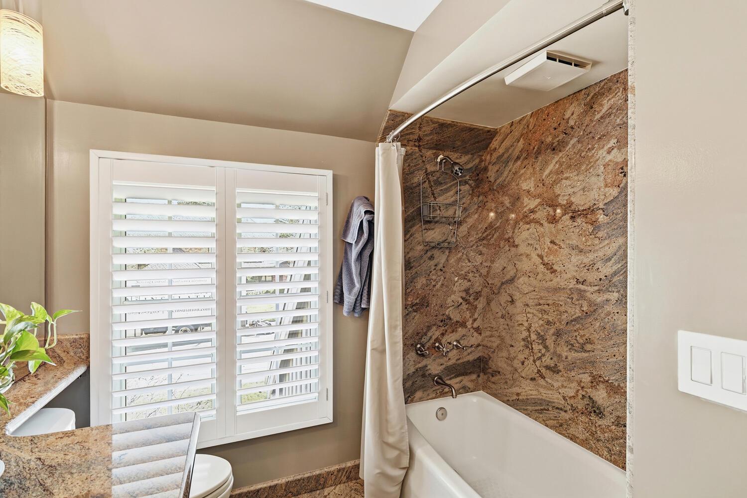 1749 Haggin Grove Way Carmichael, CA 95608 - Photo 53 of 99 a bathroom with a bathtub and shower