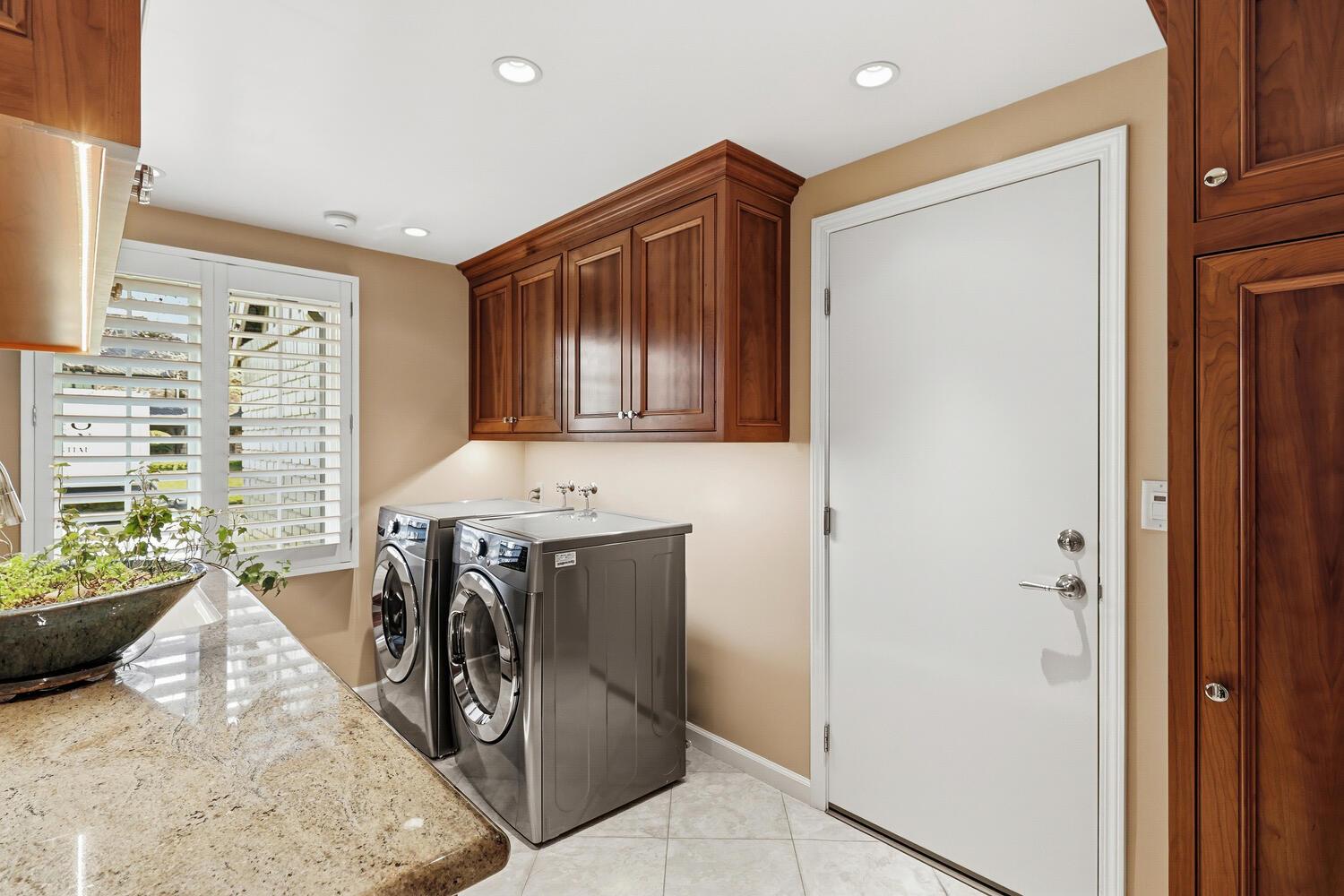 1749 Haggin Grove Way Carmichael, CA 95608 - Photo 61 of 99 a utility room with stainless steel appliances kitchen island granite countertop a refrigerator and a stove top oven