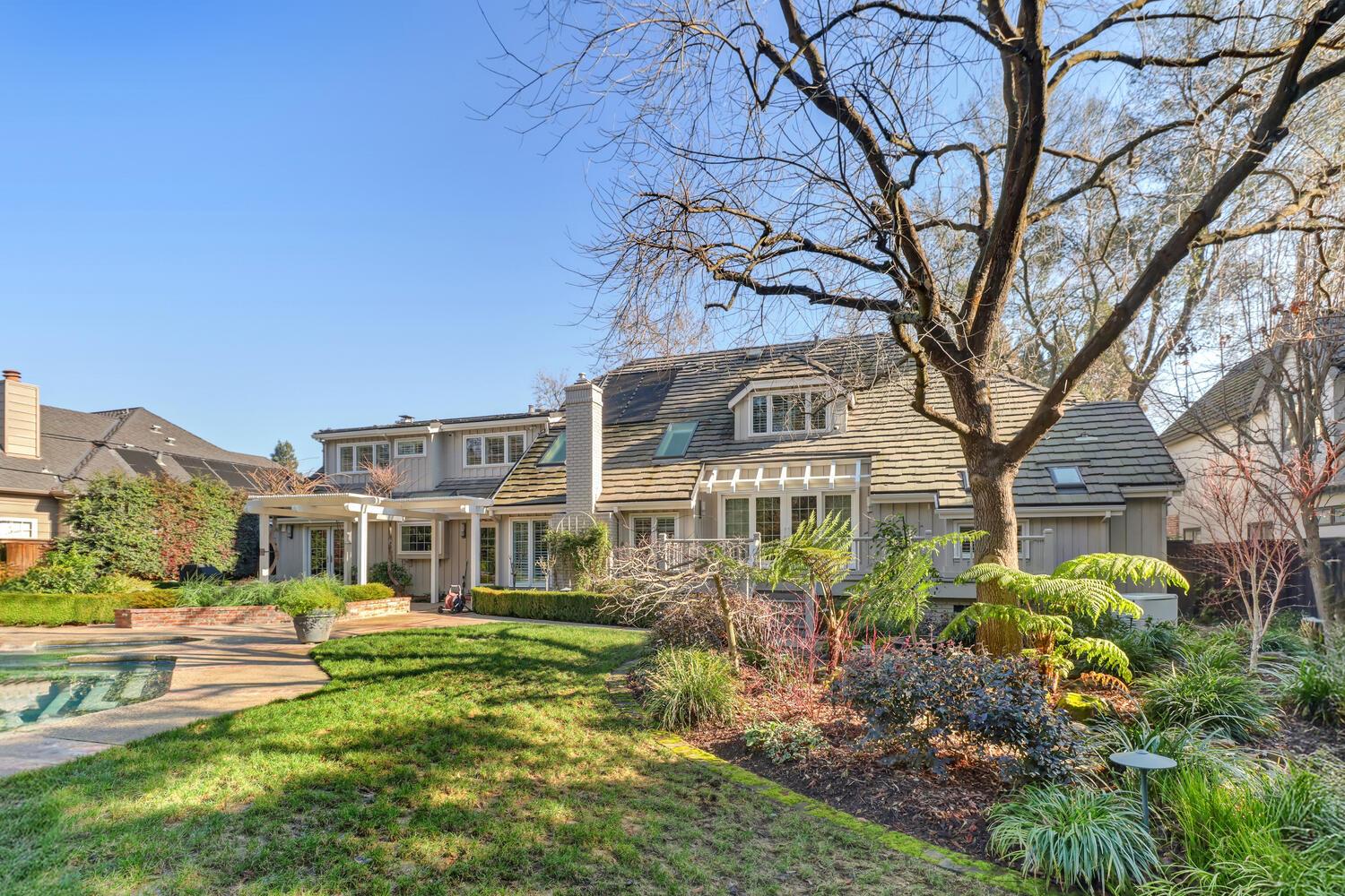 1749 Haggin Grove Way Carmichael, CA 95608 - Photo 71 of 99 a front view of a house with a garden and plants