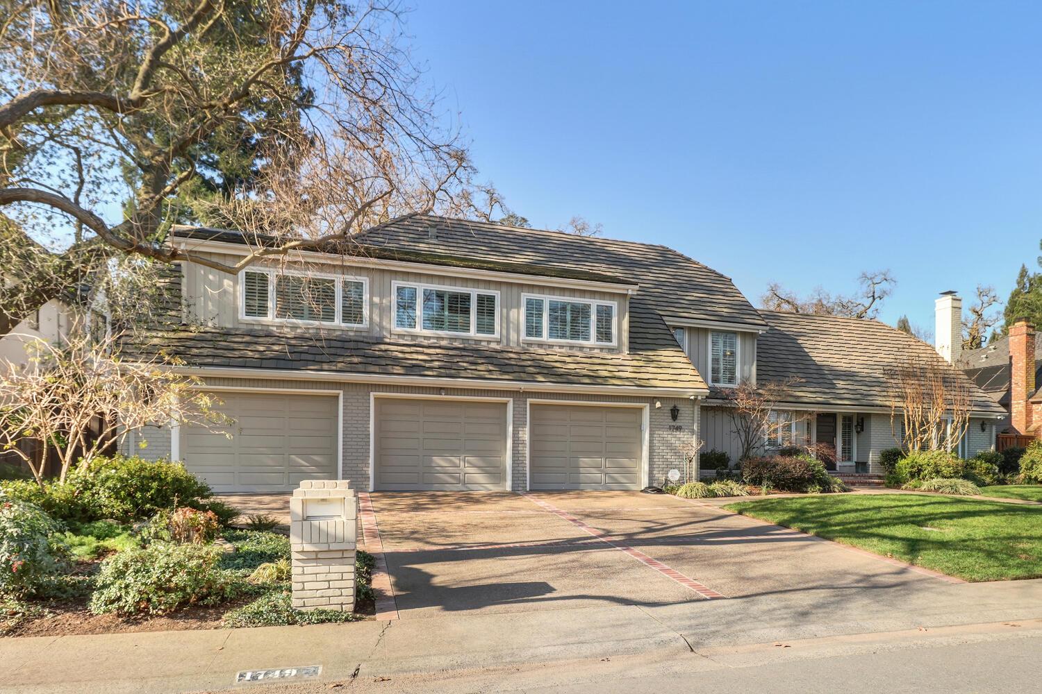 1749 Haggin Grove Way Carmichael, CA 95608 - Photo 92 of 99 a front view of a house with a garden and plants