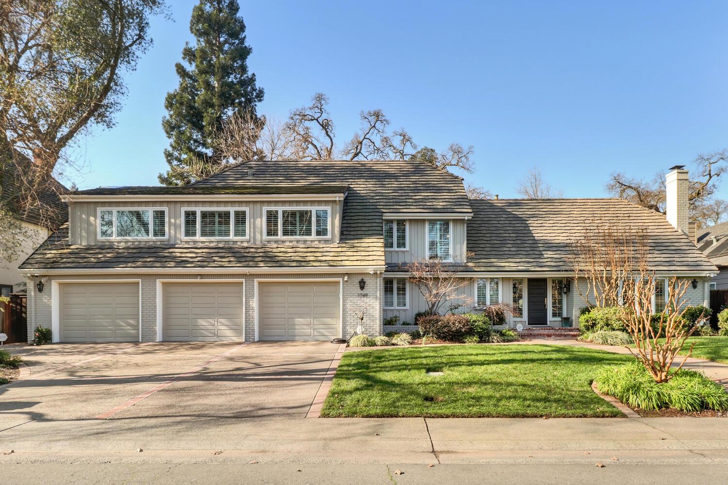 1749 Haggin Grove Way Carmichael, CA 95608 - Photo 93 of 99 a front view of a house with a garden and plants