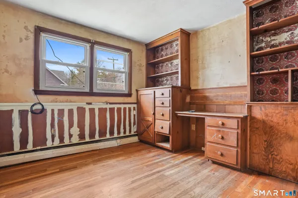 a kitchen with stainless steel appliances a stove and a refrigerator with wooden floor