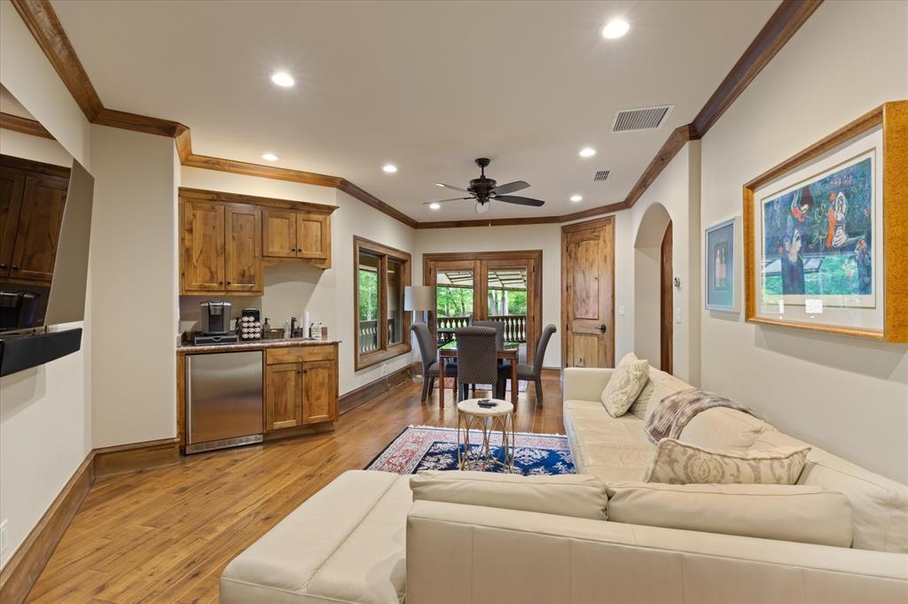 3705 Champions Ridge Lane Longview, TX 75605 - Photo 26 of 40 a living room with furniture and a open kitchen view