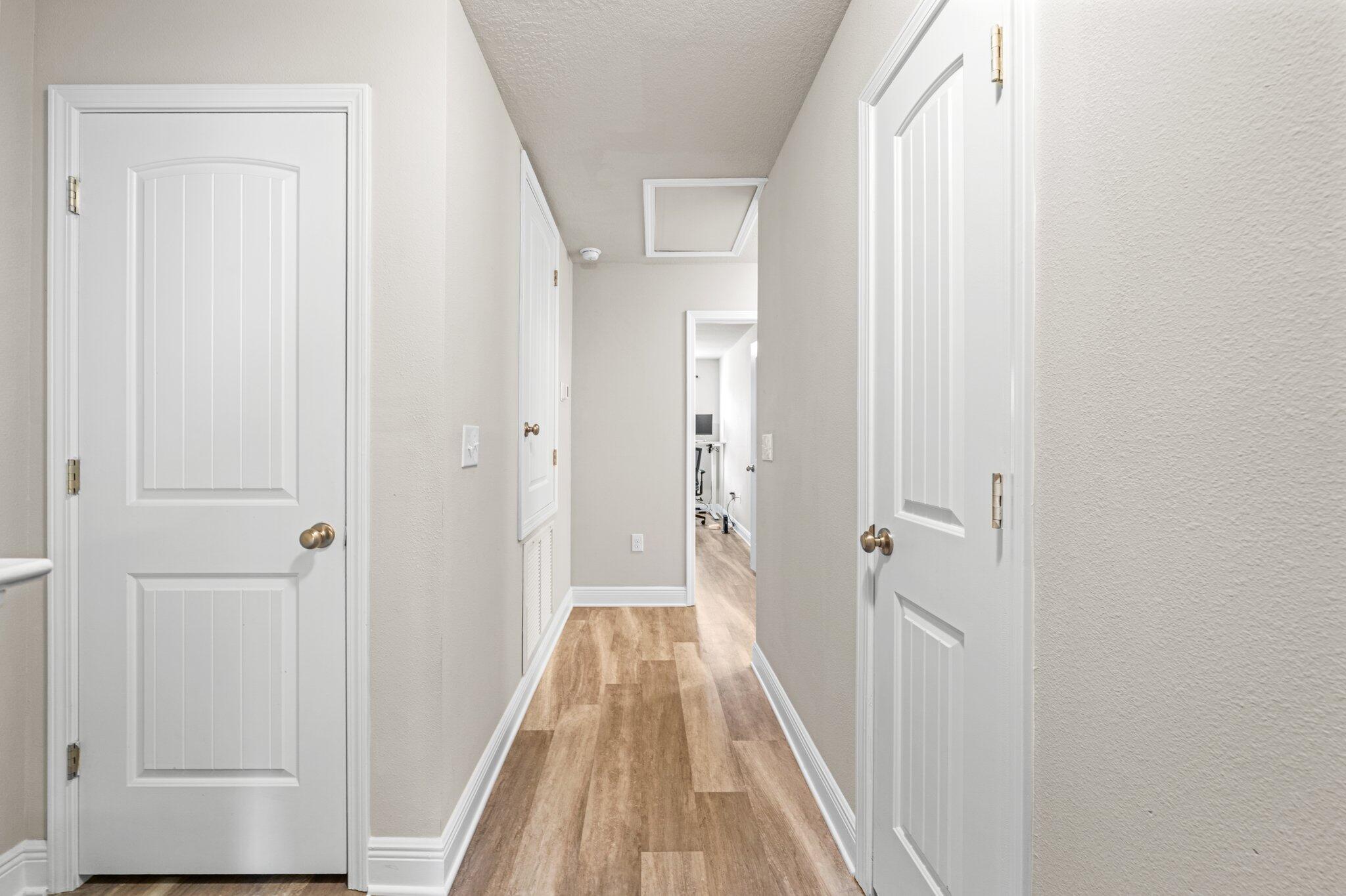 64 Crossing Lane, Unit E Santa Rosa Beach, FL 32459 - Photo 14 of 22 a view of a bathroom from a hallway