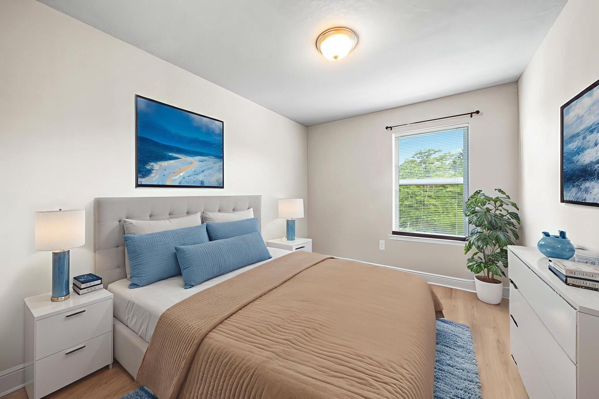 64 Crossing Lane, Unit E Santa Rosa Beach, FL 32459 - Photo 15 of 22 a bedroom with a large bed and a potted plant