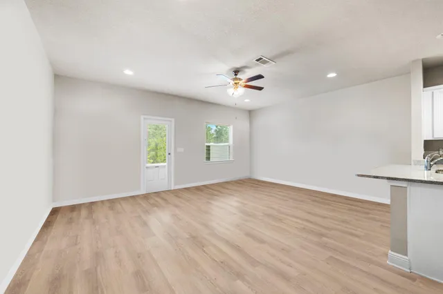 a view of an empty room with a window