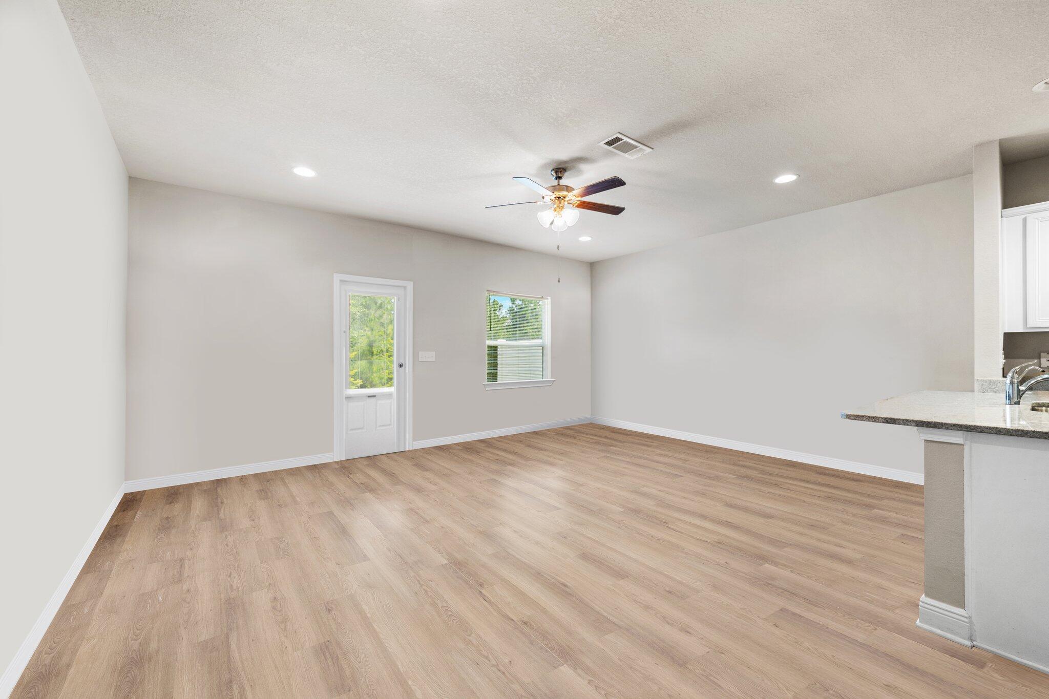 64 Crossing Lane, Unit E Santa Rosa Beach, FL 32459 - Photo 5 of 22 a view of an empty room with a window