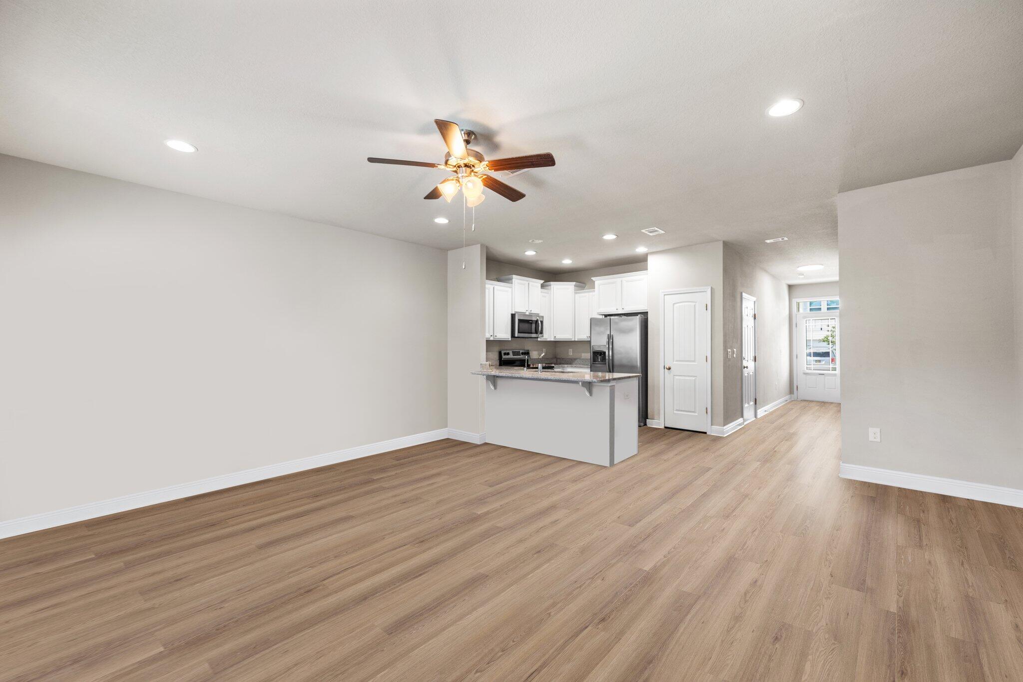 64 Crossing Lane, Unit E Santa Rosa Beach, FL 32459 - Photo 8 of 22 a view of a kitchen with a sink and a refrigerator
